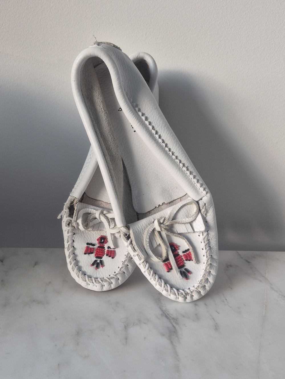 Minnetonka White Leather Moccasins with Red Bead Cross Motif